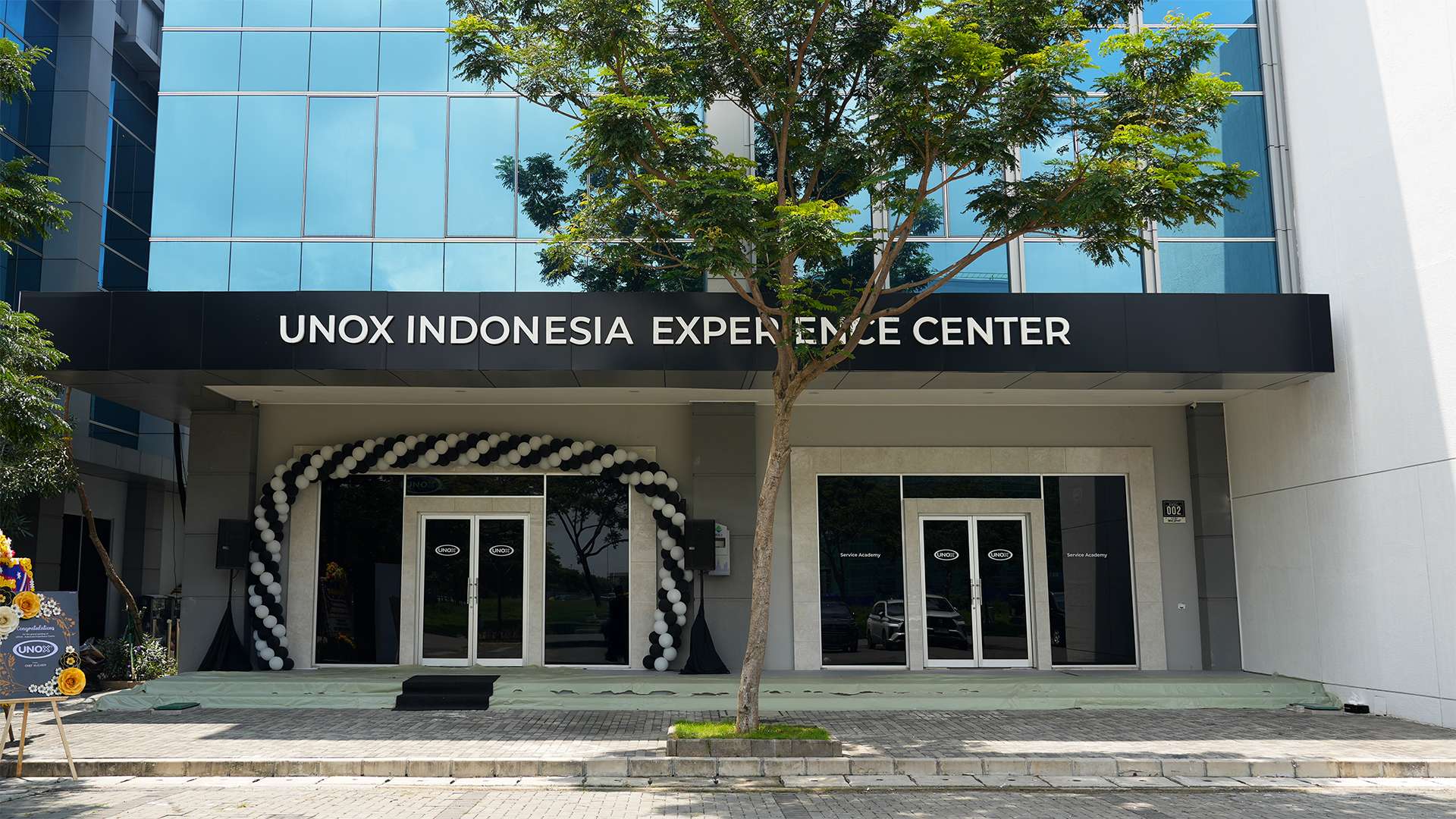 Large commercial building with Unox Indonesia Experience Centre written on the sign.